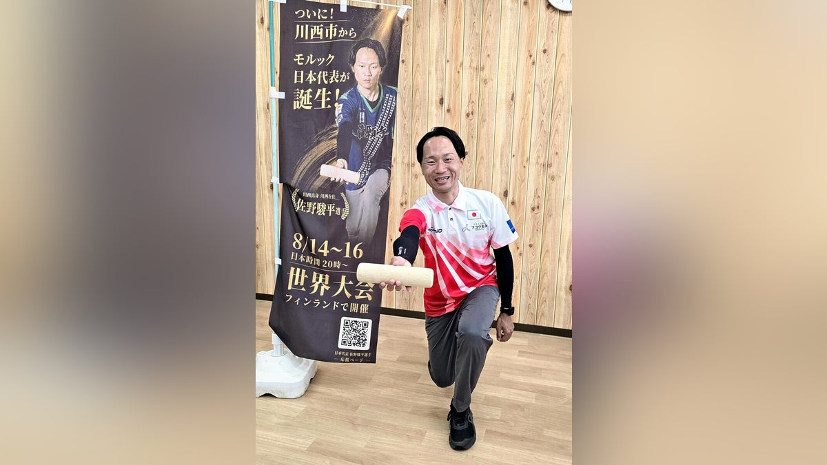 世界大会出場を伝える佐野駿平の写真